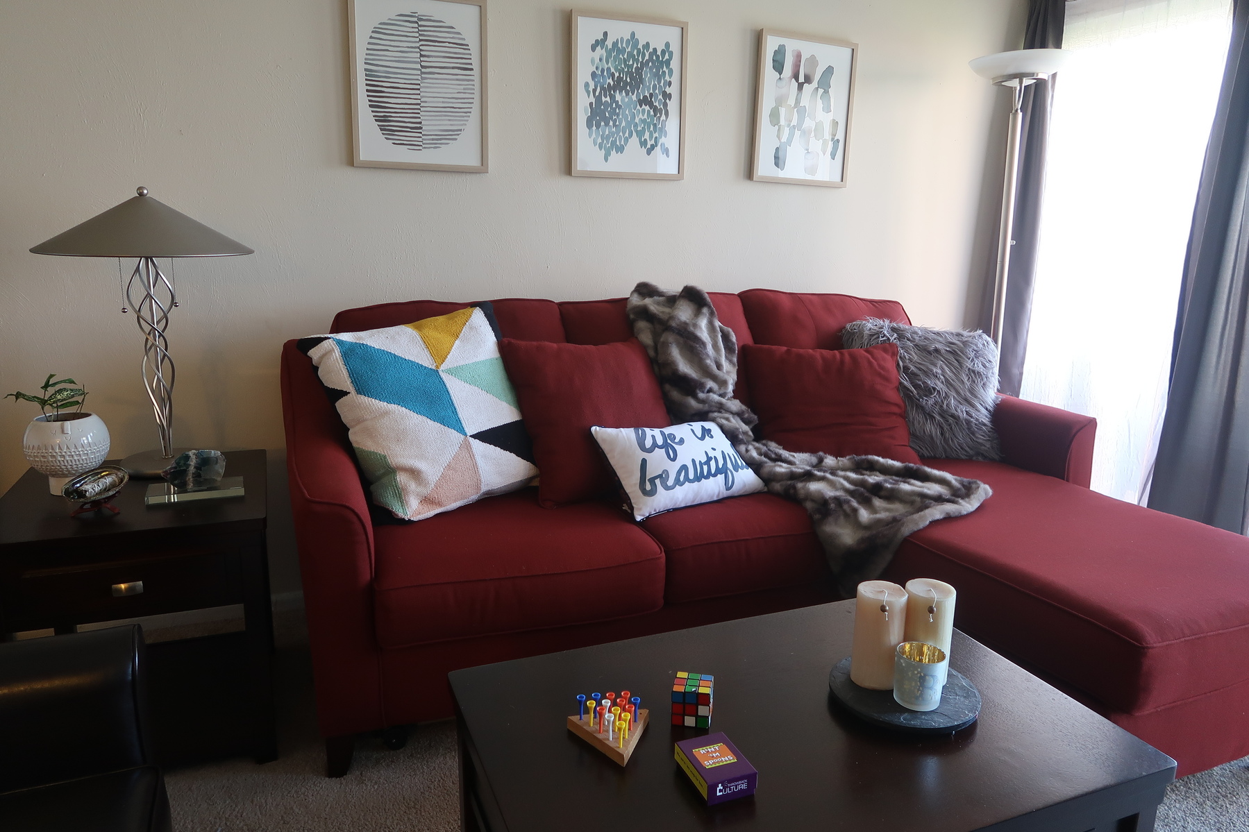 3 Ways to Work Around a Red Sofa When Styling Your Living Room Decor