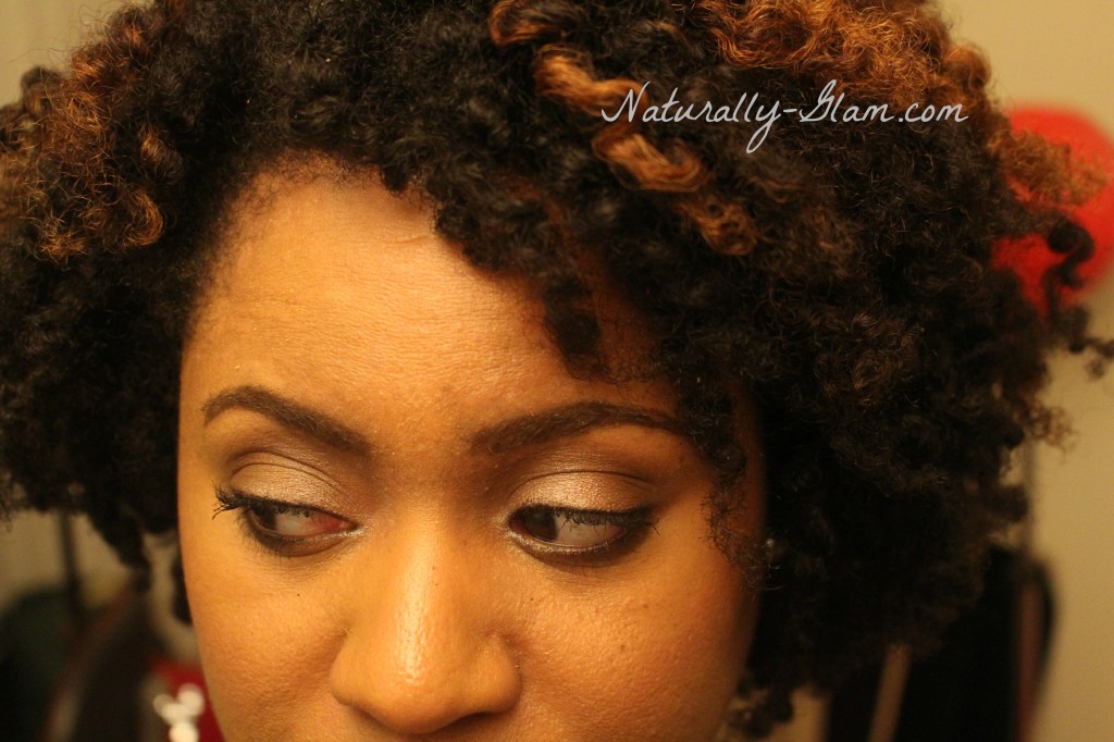 neutral makeup look on black woman with natural hair